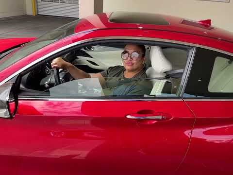 Kimberly Bailey Tureaud in her Infiniti Q60 Red Sport.